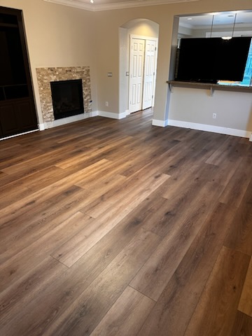 wood flooring installation in living room dining room area